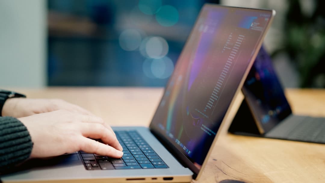 A person using a laptop to make a secure online payment for a court fine