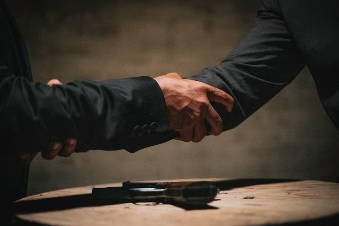 gavel and a handshake representing legal settlement
