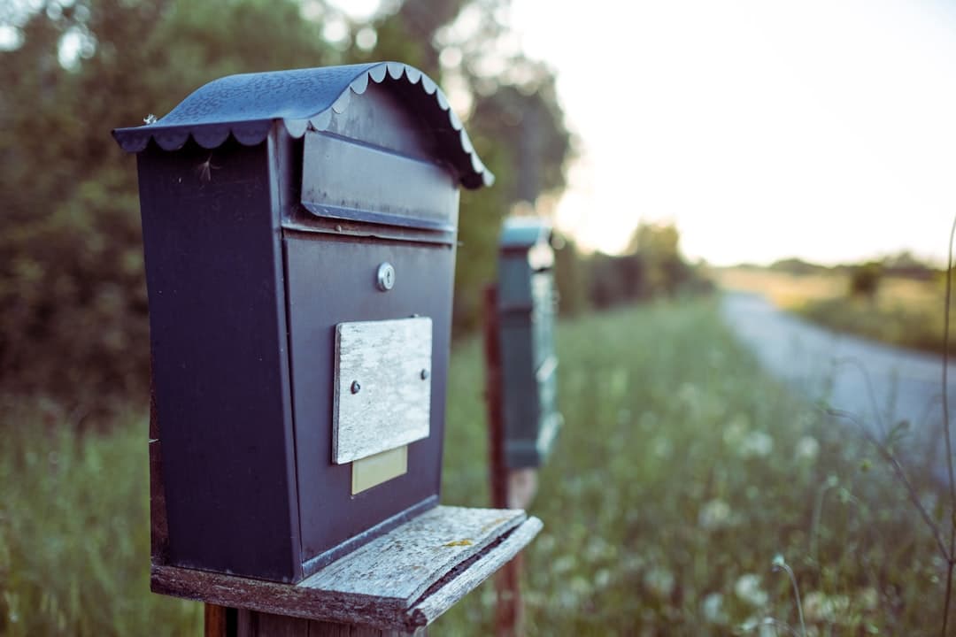person looking stressed at a mailbox summons complaint