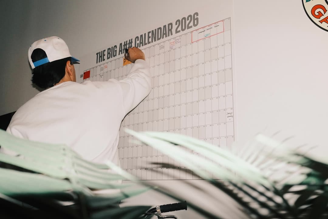 A person marking a calendar with a red circle to track a legal deadline
