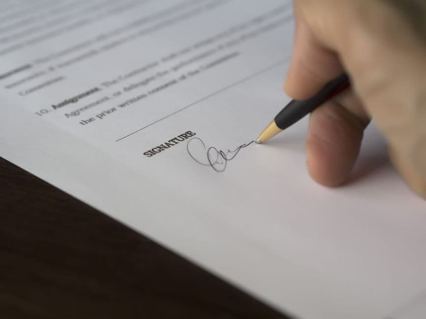 signed contract on a desk