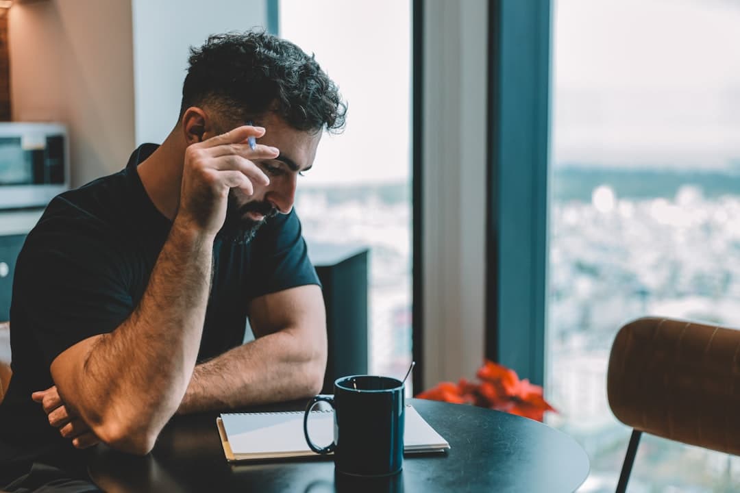 A person looking stressed while reading a legal letter